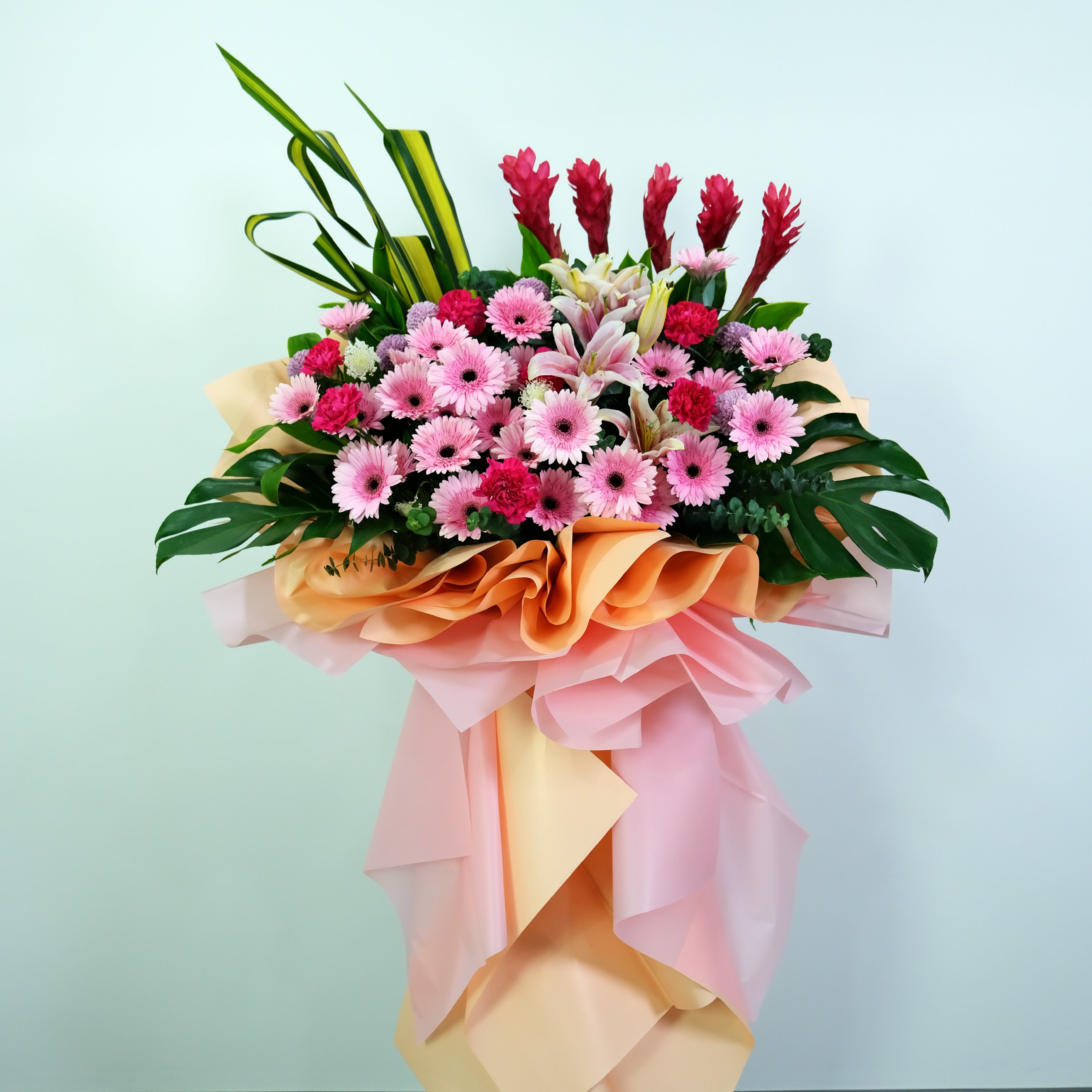 opening flower stand with pink and green elements on a light blue background