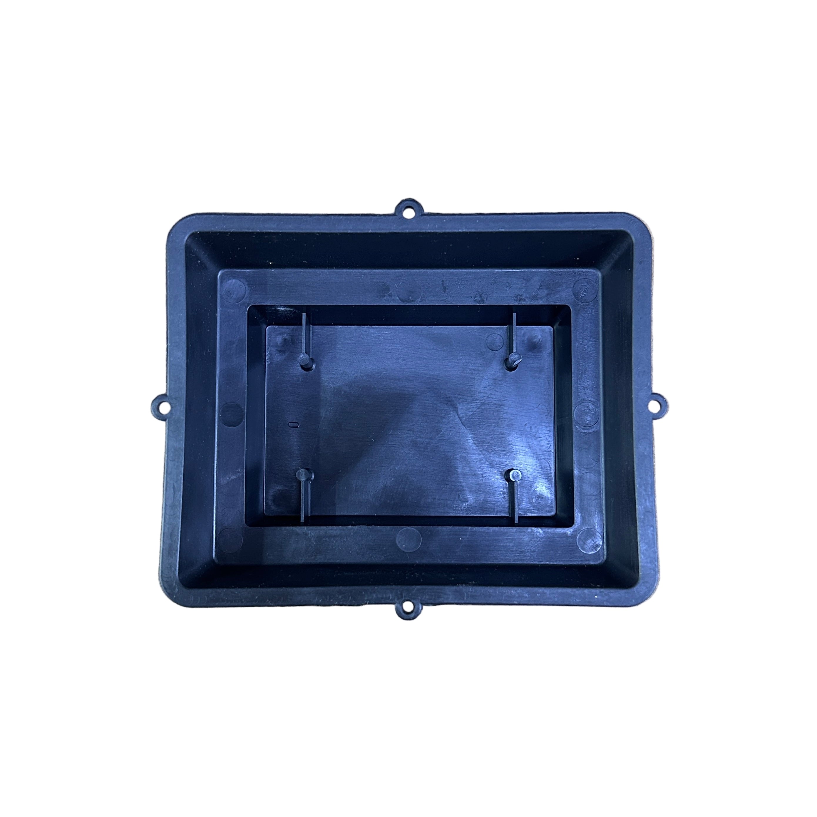 Black rectangular plastic floral container on a concrete surface