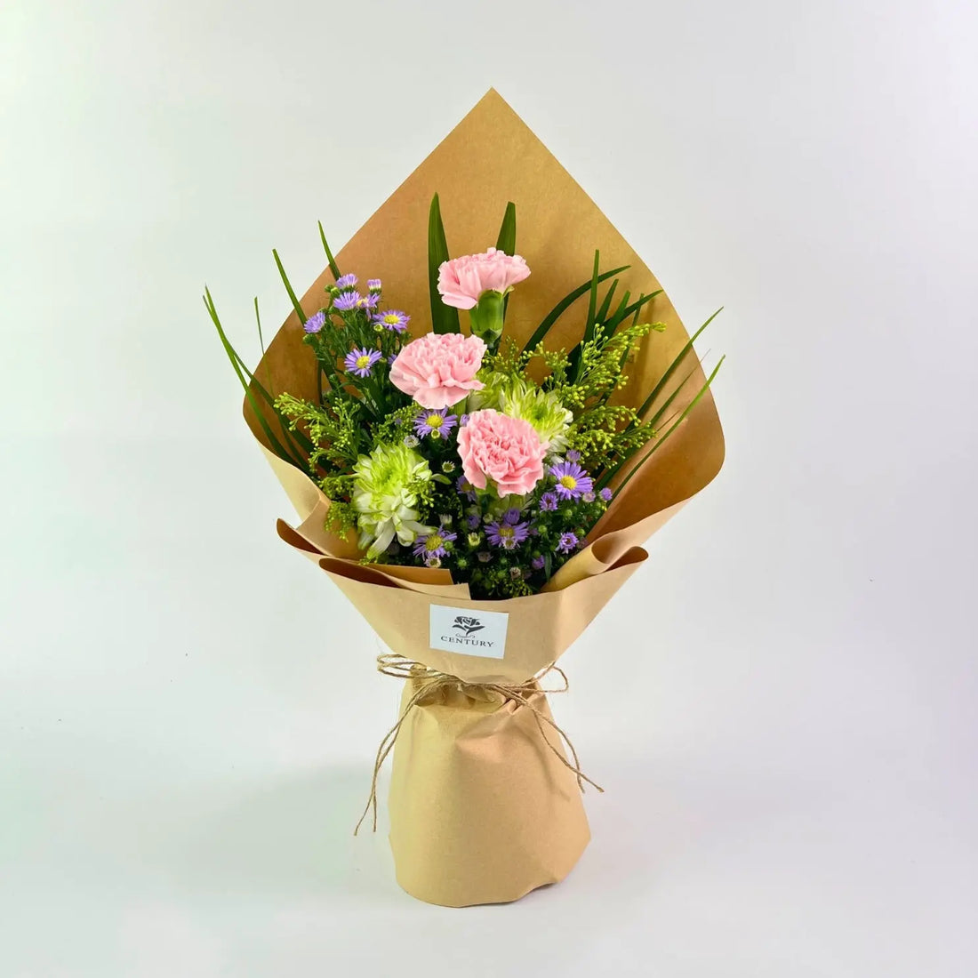 Adinda Bouquet from Century Flower Bunga Kita Collection with pink carnations and purple asters in a rustic kraft wrap.