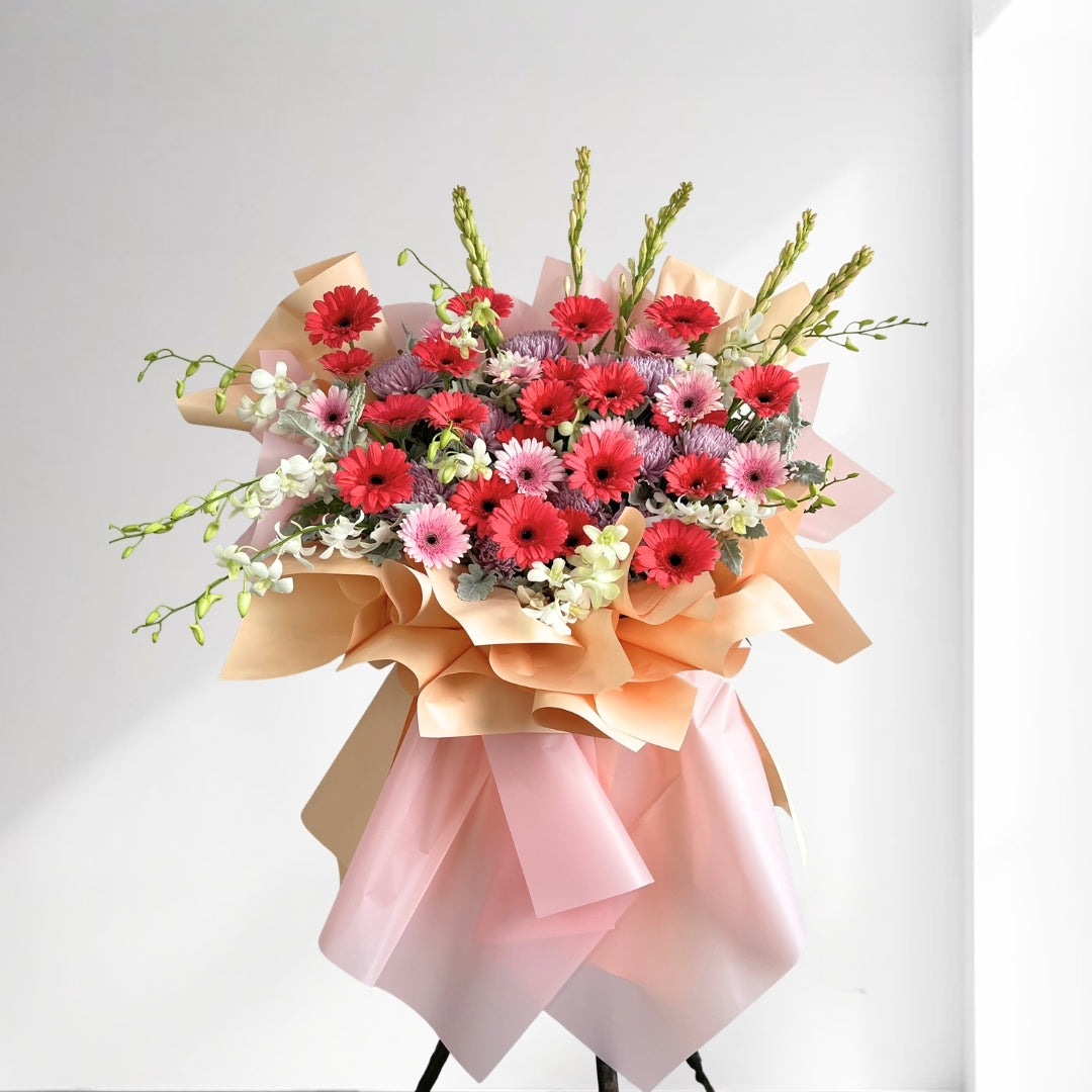 Bouquet of flowers with pink and red colors on a white background
