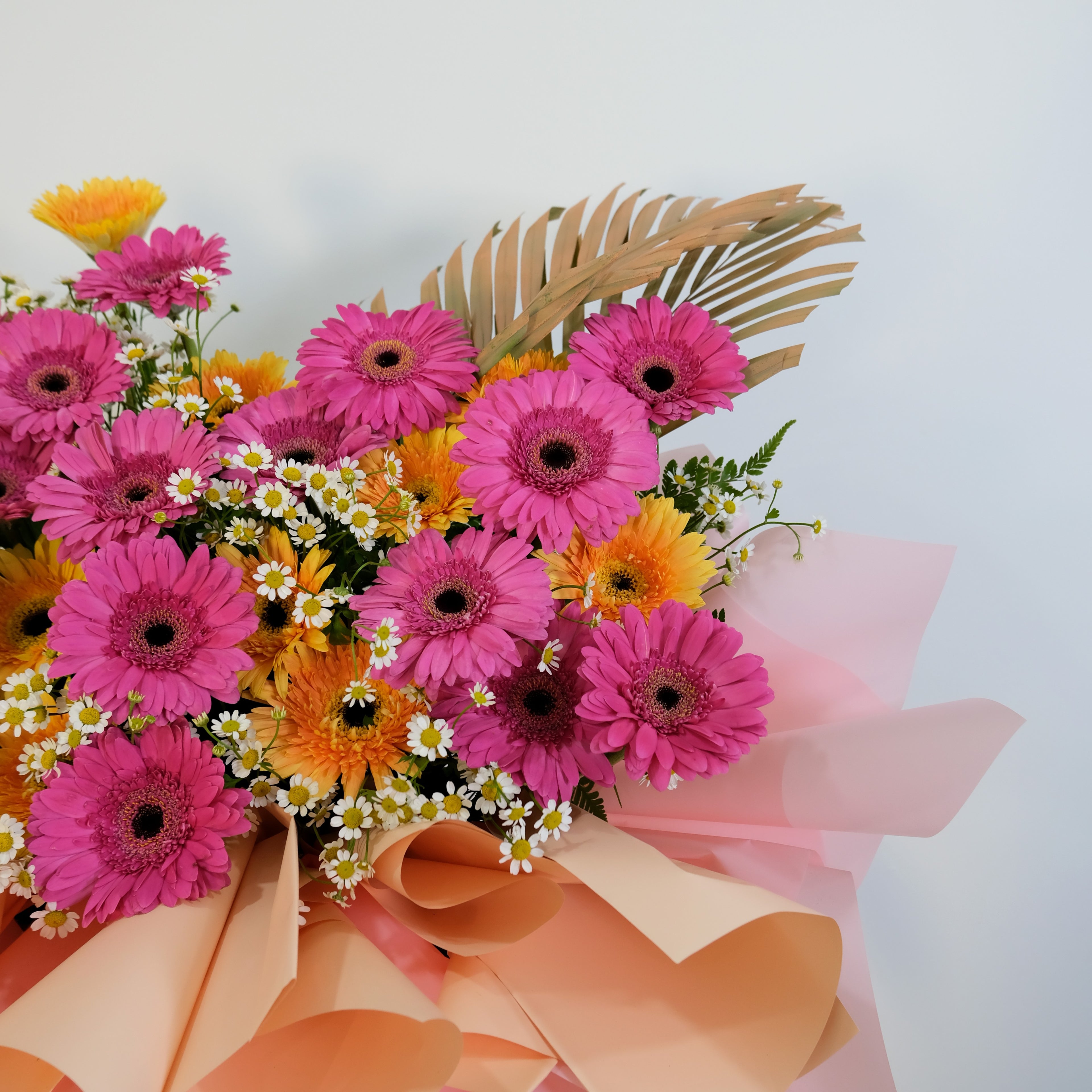flower stand Bouquet of pink and orange flowers with a white background