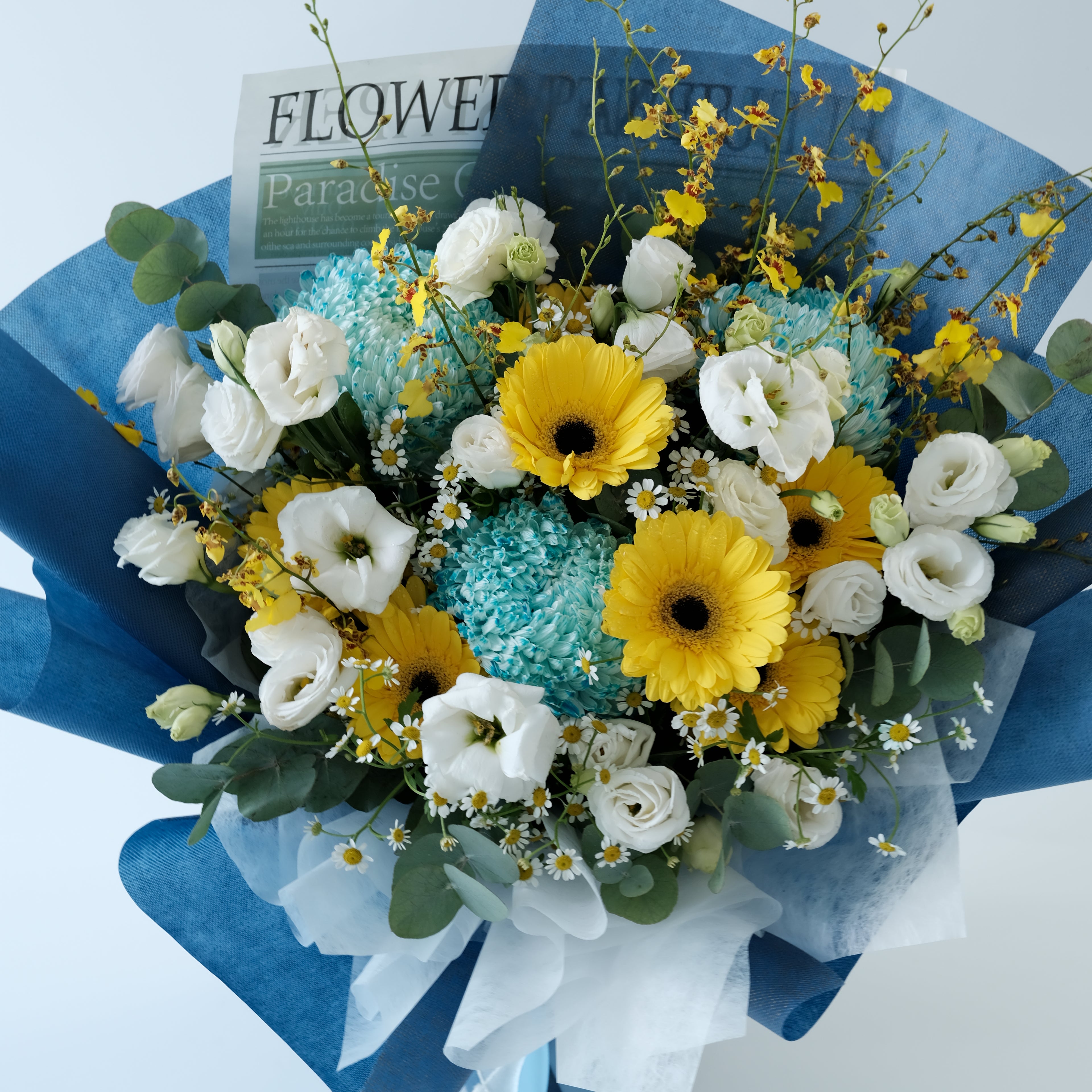 Bouquet of flowers with white, yellow, and green colors on a blue background