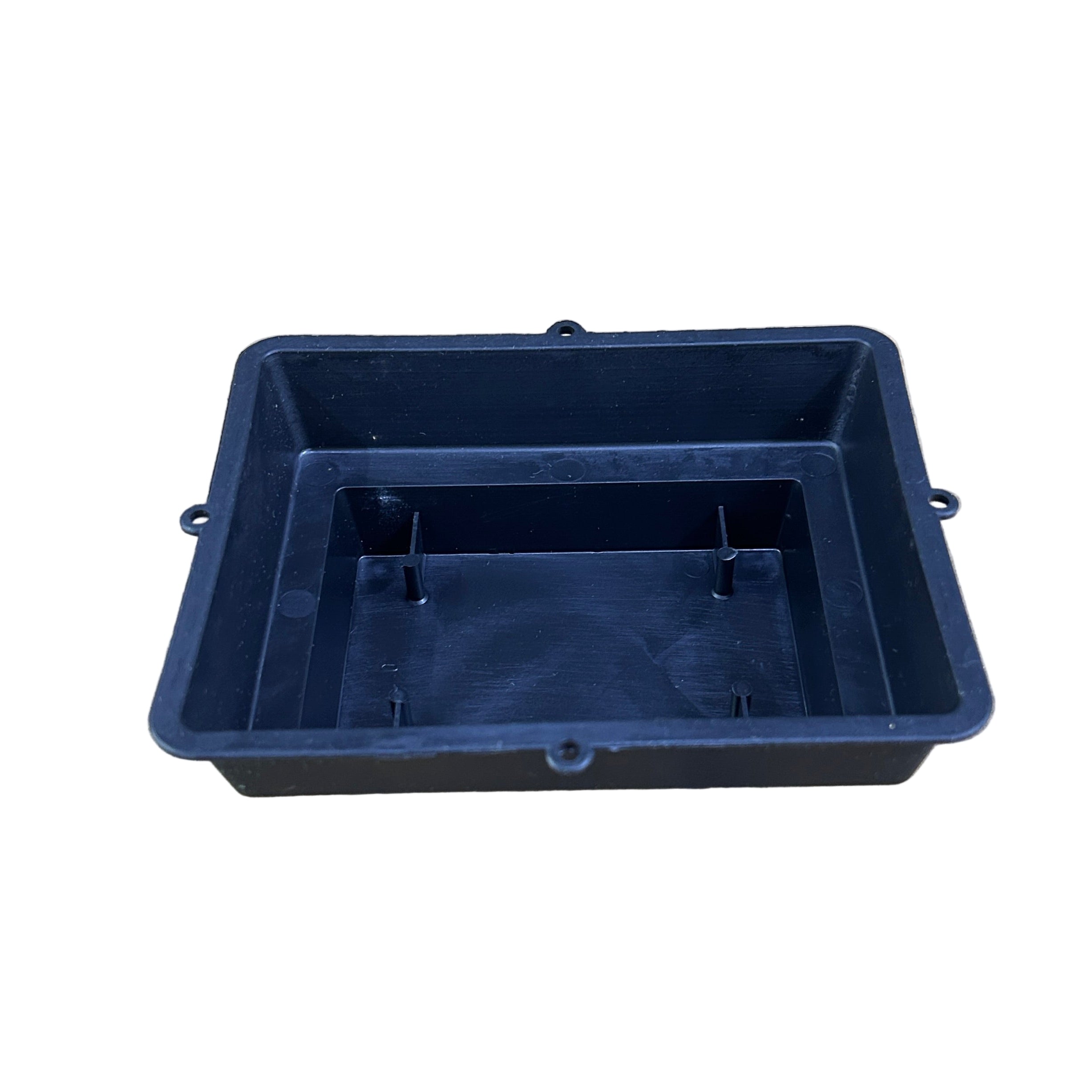 Black plastic floral container on a concrete surface