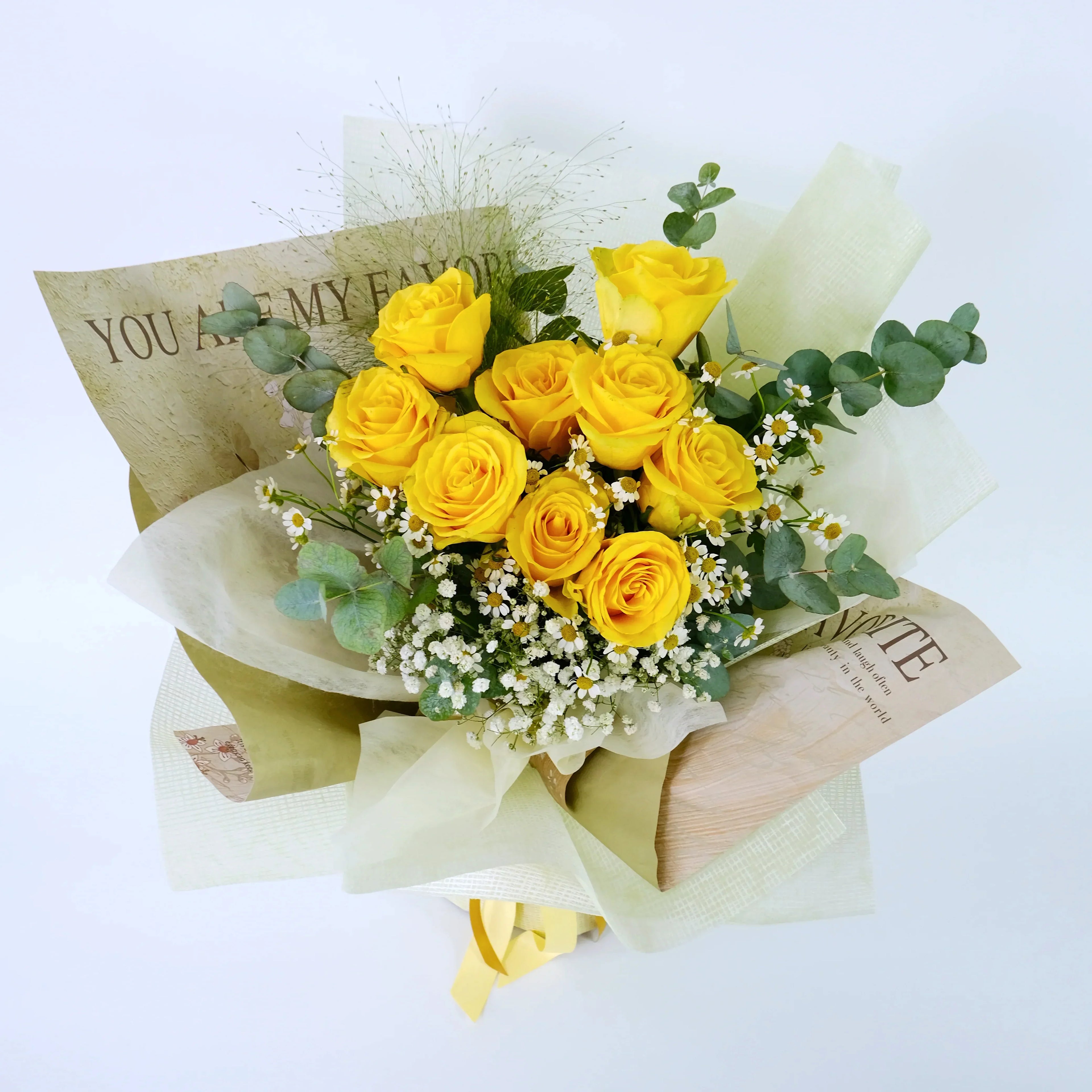 Yellow rose bouquet with baby's breath, eucalyptus, and decorative wrapping