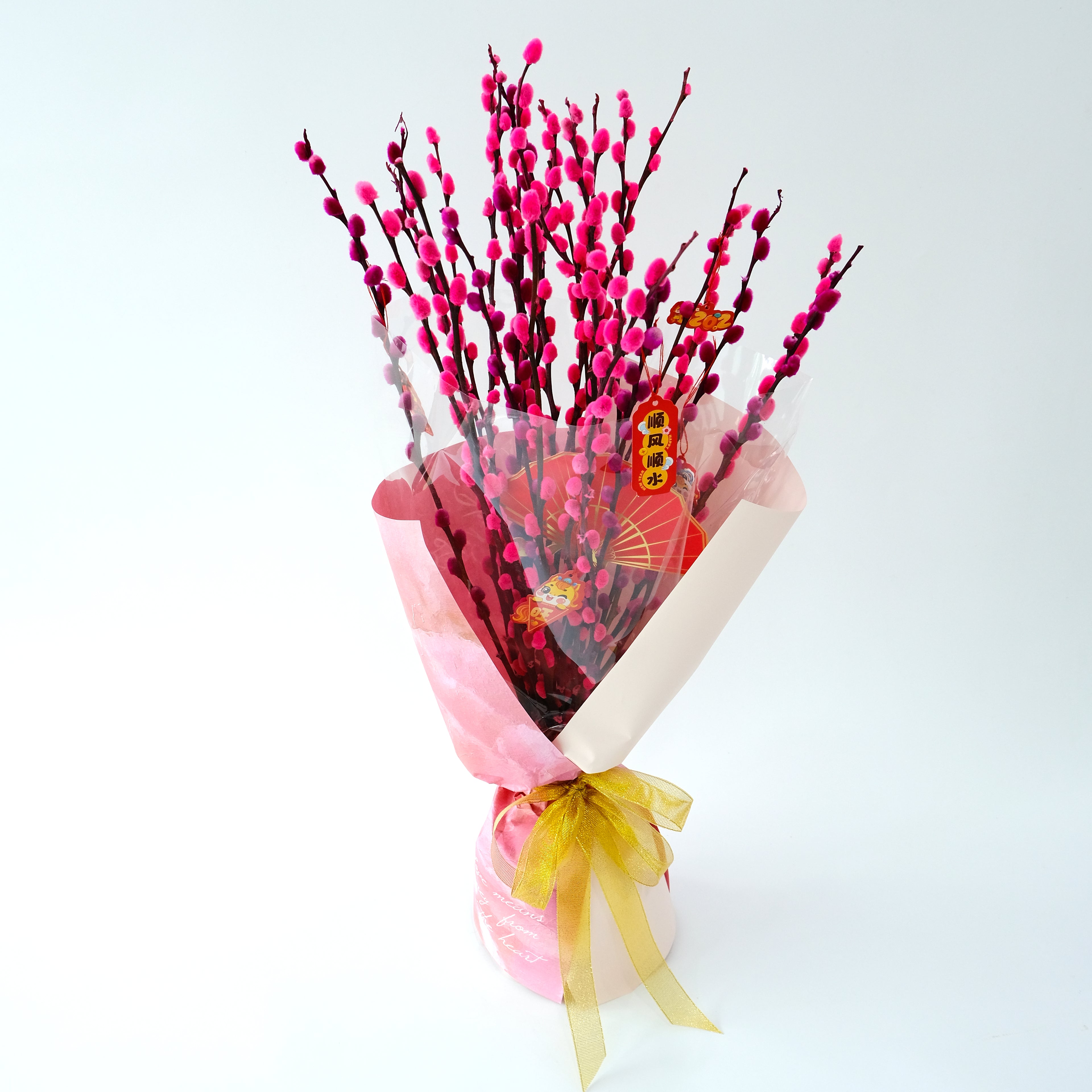 CNY Hong Yun Bouquet with pink pussy willow branches and traditional ornaments in a designer pink wrap for luxury delivery in KL.