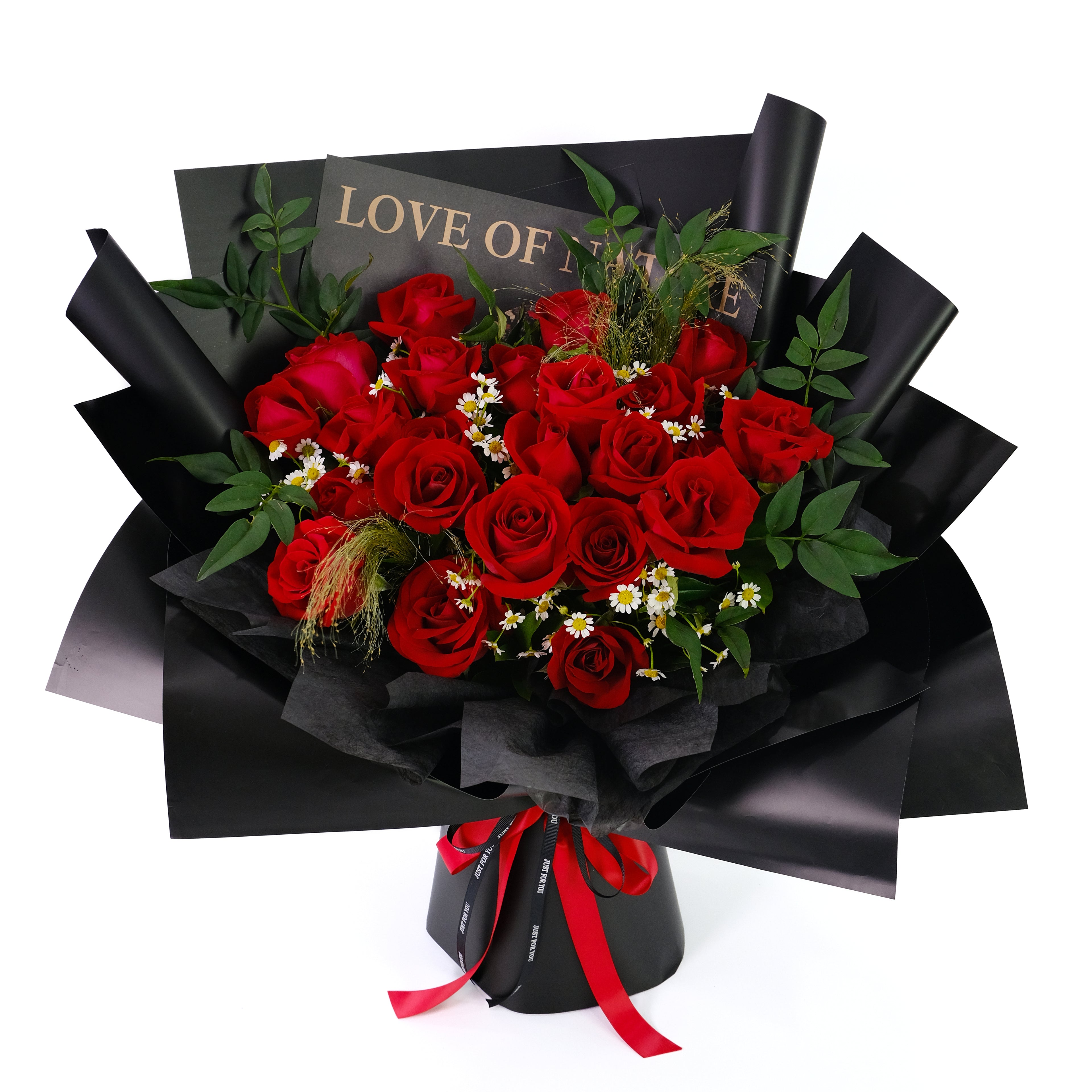 Bouquet of red roses wrapped in black paper with a red ribbon on a white background